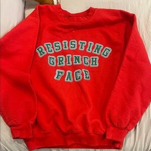 Gildan Red Crewneck Sweater with 'Resisting Grinch Face'
